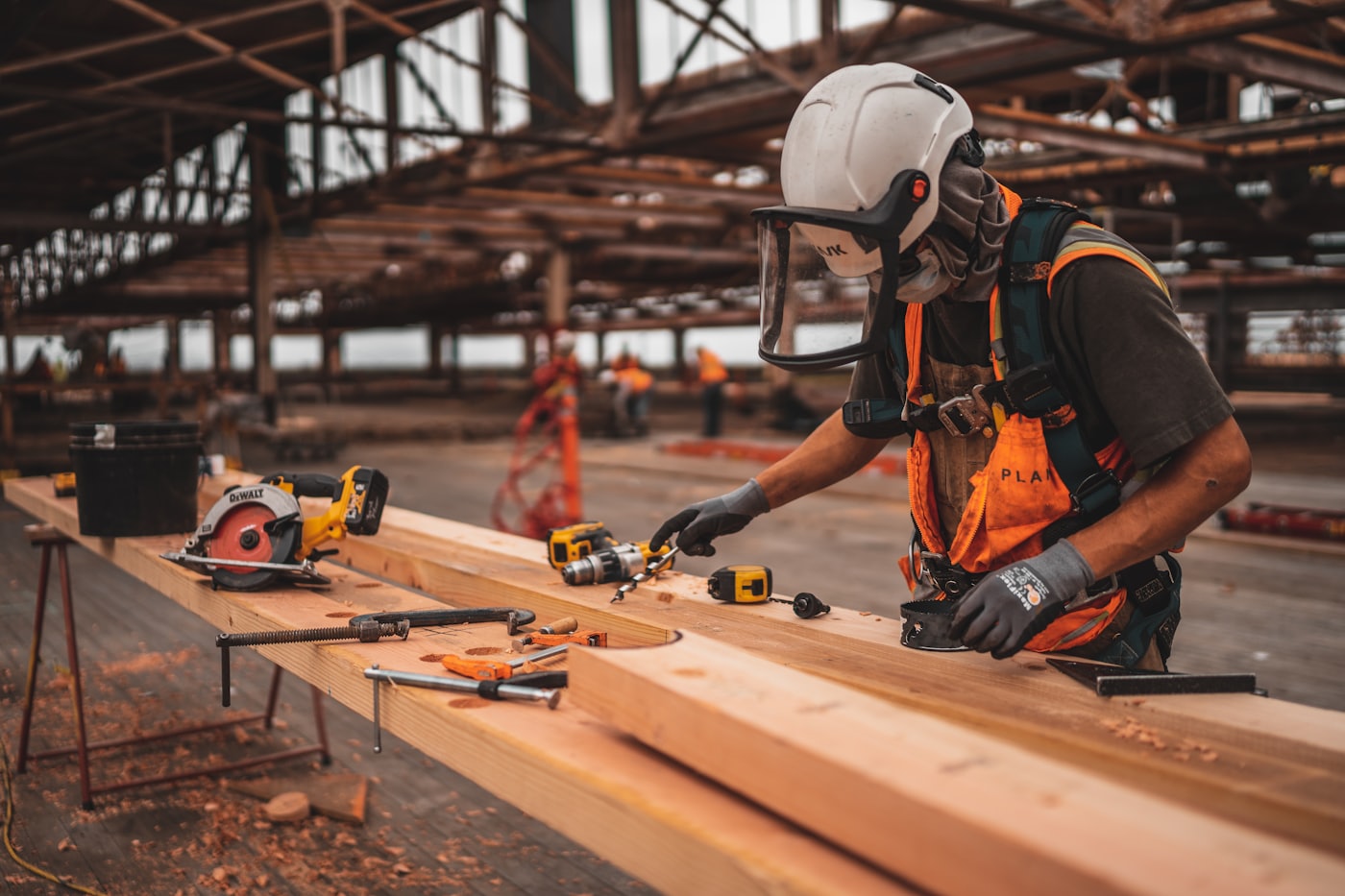 Carpenter cutting timber in a workshop